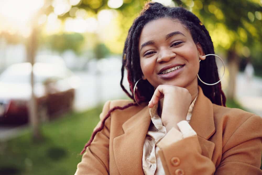 Young black woman with traditional locs on type 4C natural hair