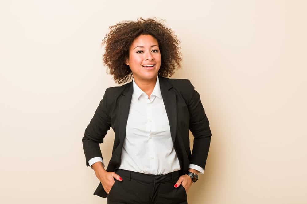 Cute black girl wearing a business suit with naturally curly hair