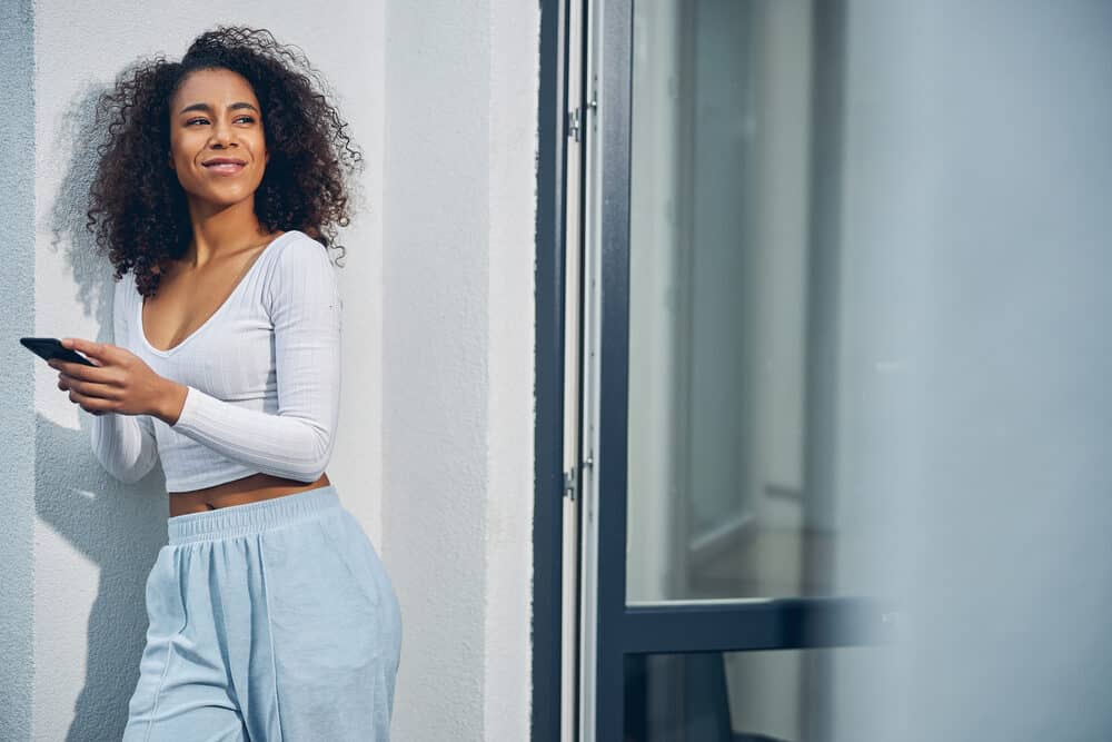 Attractive black female wearing a soft t-shirt with type 4a human hair