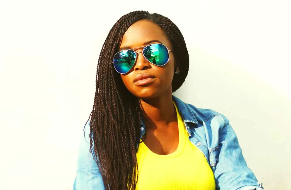 5 DIY Protective Hairstyles That Can Get Wet for Natural Hair 1 Black woman with healthy hair in crochet braids which is a protective hairstyle