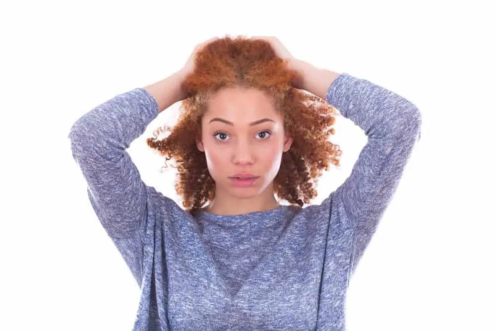 Can Black People Have Red Hair? Common Factors and Misconceptions 8 A mixed-raced adult female of Celtic descent with curly red hair; it's uncommon to see ginger hair on black women
