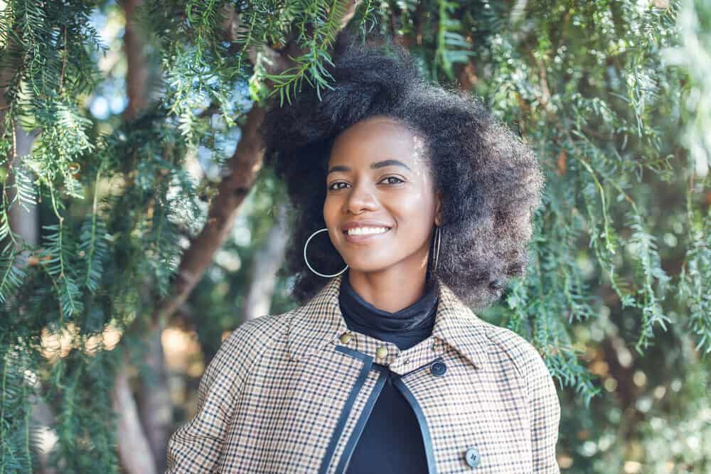 Young woman with an afro hairstyle created with a wide-tooth comb