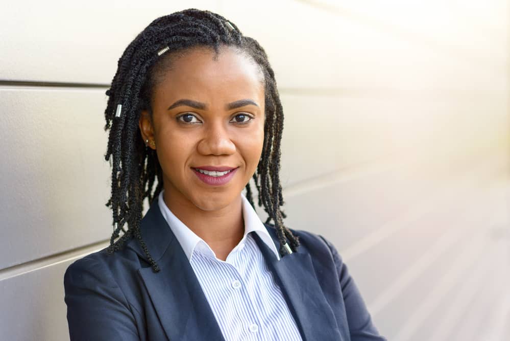 Cute African American female with adult stage locs on natural hair started with two-strand twists