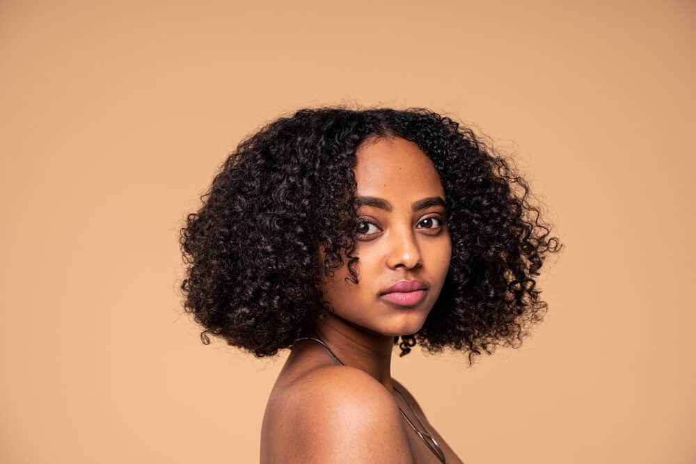 Beautiful, young African-American woman wearing pink lipstick