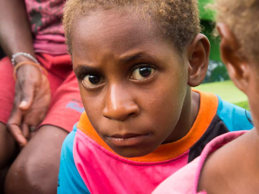 A black kid in the South Pacific, Solomon Island, where blond hair arose independently