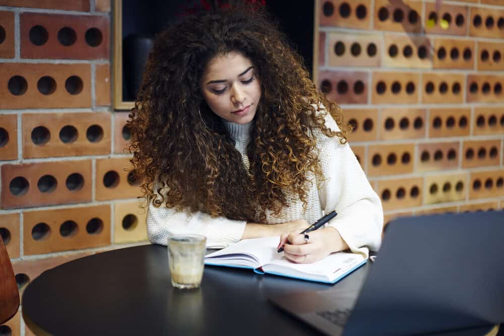 Cute white girl with common Caucasian hair density - the thickest hair types between all ethnic categories. 
