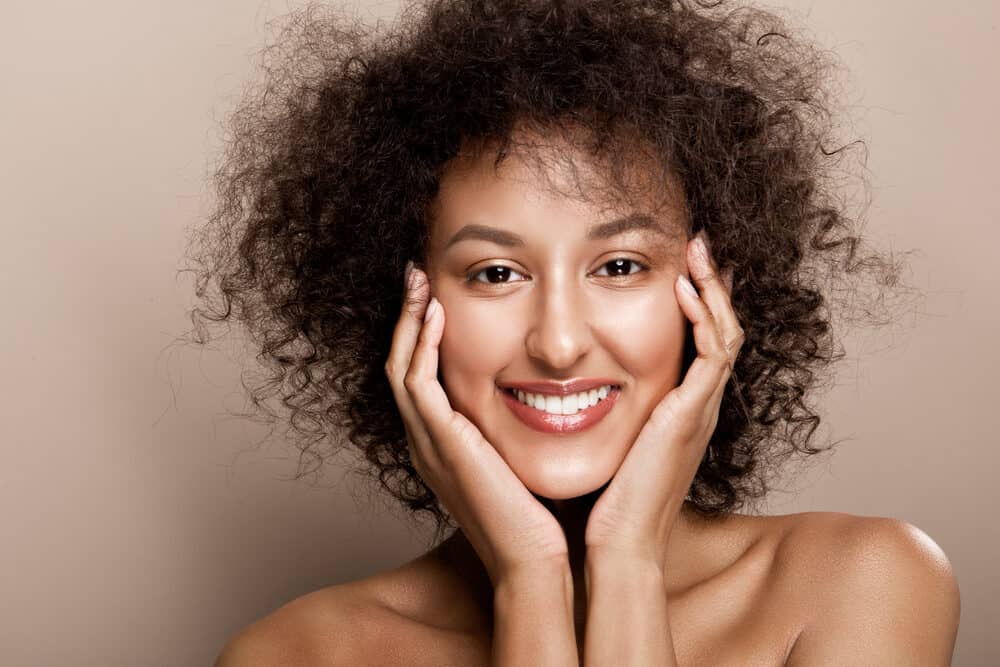 Beautiful African American woman with big waves and curls