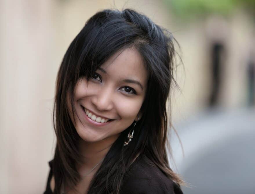 Young Asian woman with dense hair and more strands per hair diameter than any other ethnic group