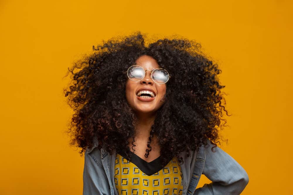 African American woman wearing real human hair tape hair extensions