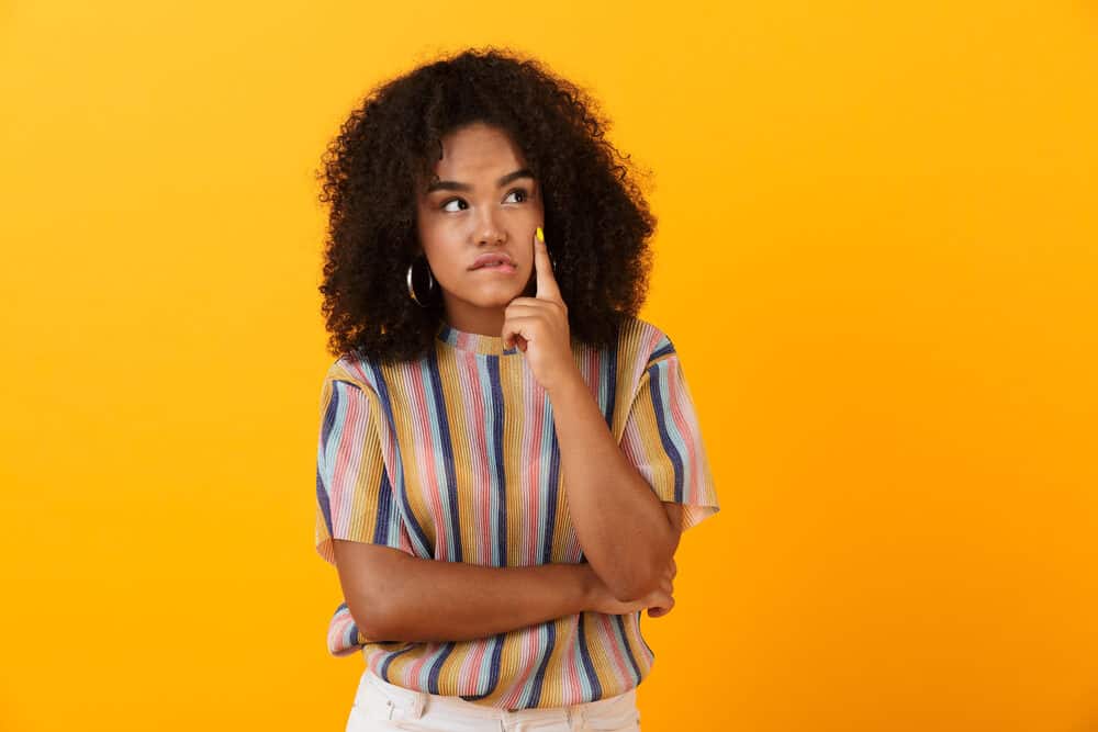 Black girl wondering if she should straighten her kitchen hair with a hot comb