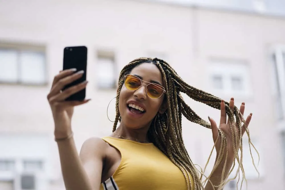 How To Fix Frizzy Braids and Keep Braids From Frizzing Up 1 Cute African-Latin female wearing synthetic hair braided in box braids