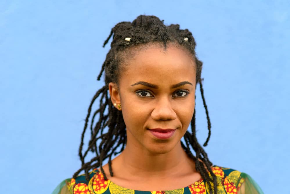 African American female with dirty locks and an itchy scalp