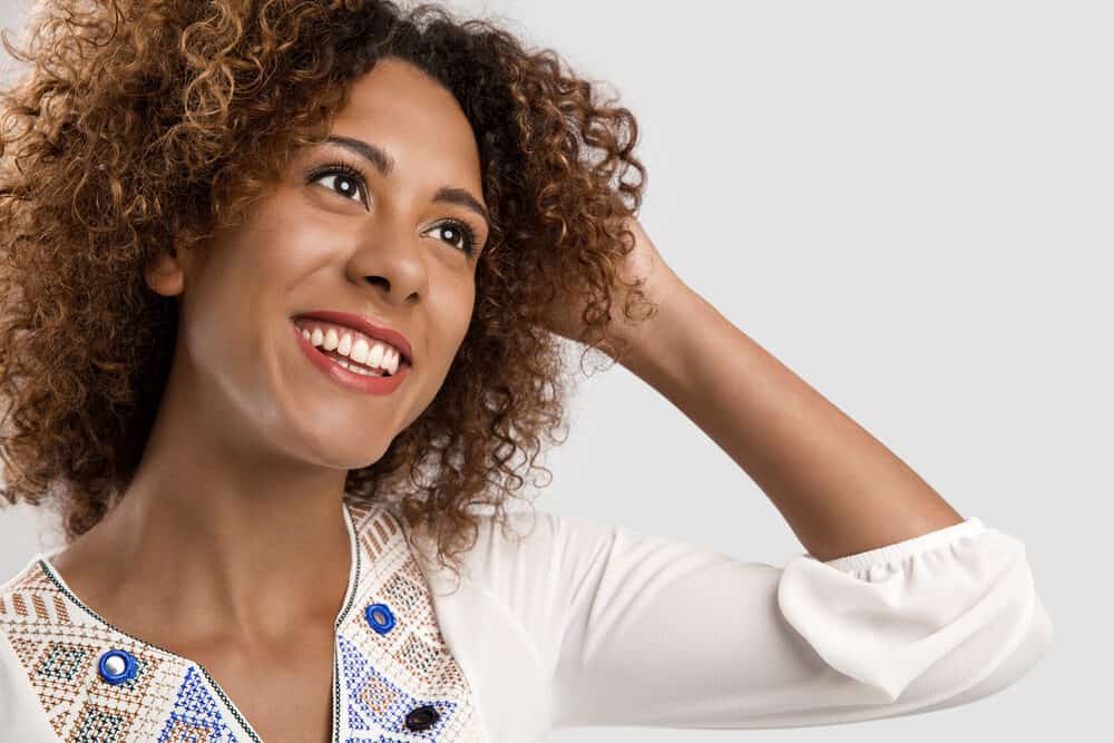 Beautiful African American woman going to the post office to sell used hair extensions