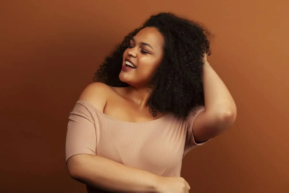 The Benefits of Using Horse Shampoo on Human Hair for Growth, Thickness, and More 6 African American lady that uses Mane N Tail shampoo and conditioner to make her hair grow