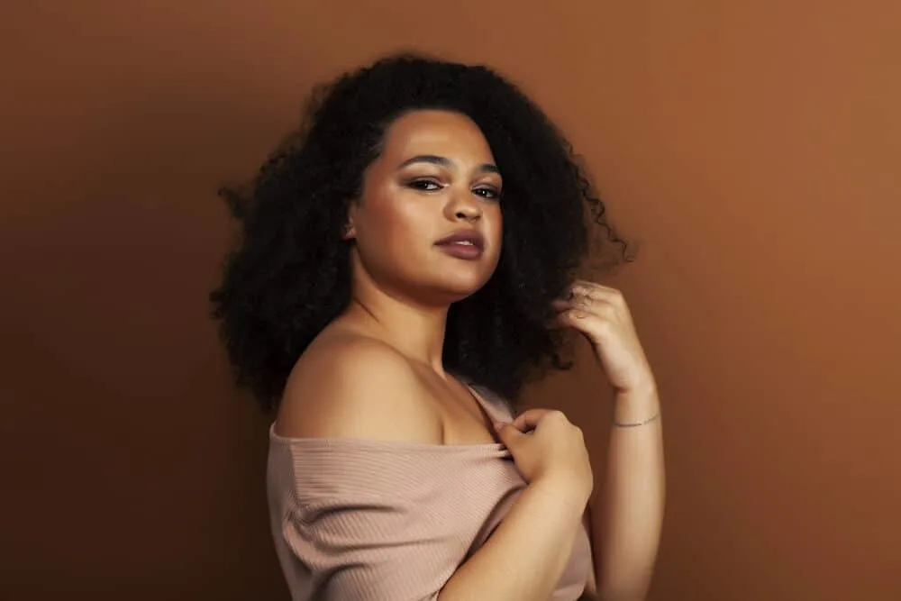The Benefits of Using Horse Shampoo on Human Hair for Growth, Thickness, and More 5 Beautiful black girl with naturally curly human hair without any medicinal or steroidal chemicals