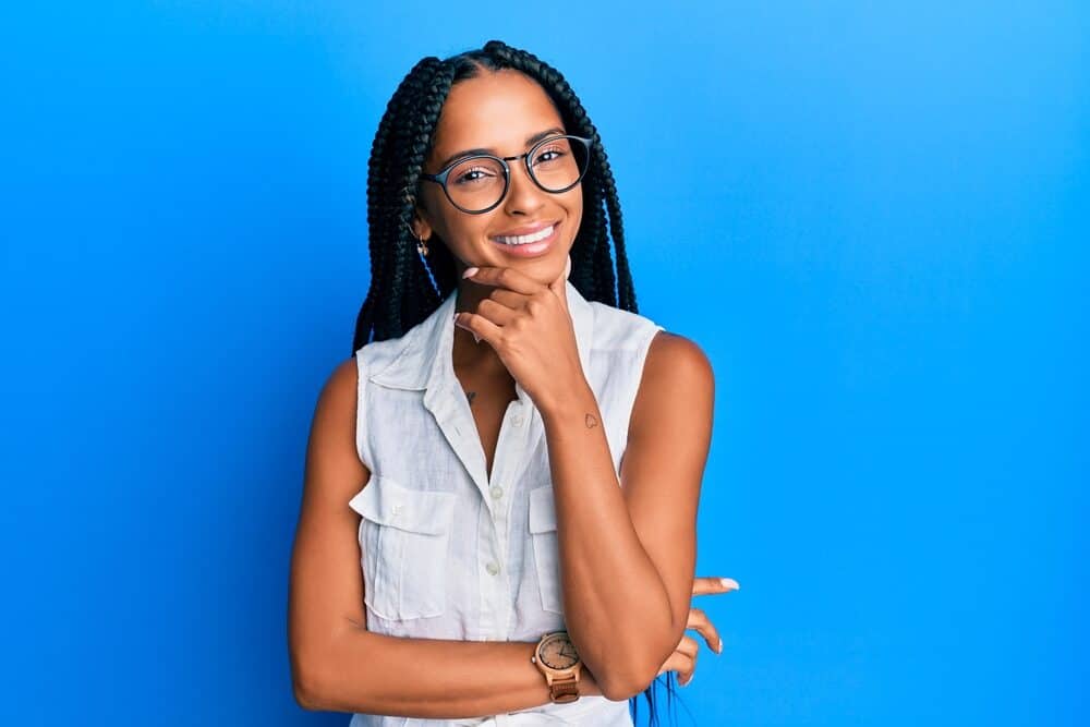 Beautiful black girl wearing knotless braids as a protective style for her own hair