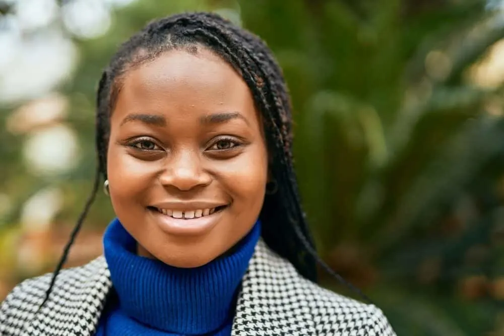 Sea Salt and Lemon Juice on Dreads: Is It Good? What Does It Do? Complete Guide 6 African American girl with healthy locs soaking up the vitamin D outside near the beach