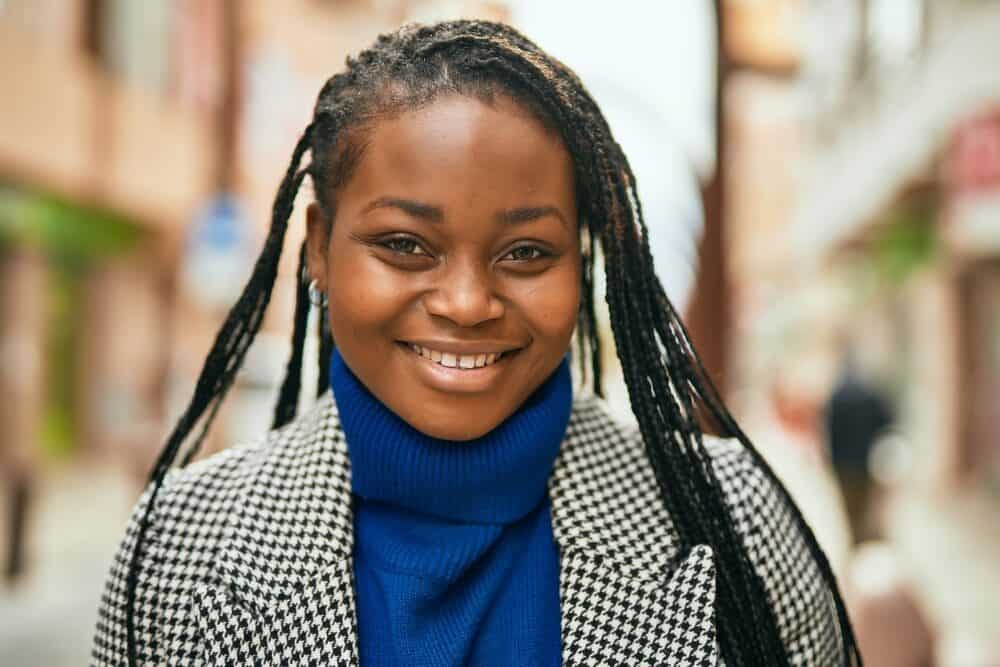 Black woman with pretty brown skin wearing thin sisterlocks