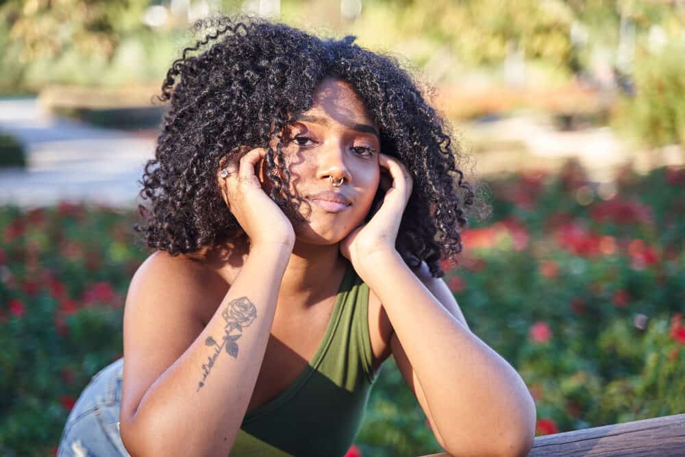 Curly-haired Latina woman after using dish washing soap to wash her hair