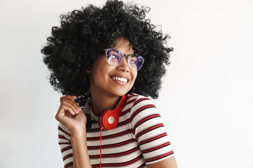 African American girl with dry hair styled with a bonnet hair dryer for long or curly hair