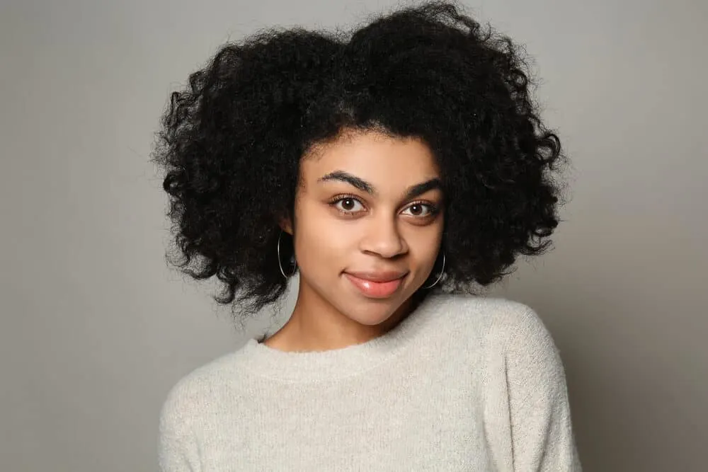 Do Hair Products Expire? Can You Use Expired Hair Products? 1 A cute black girl that suffered from hair loss after using expired products with a shorter shelf life.