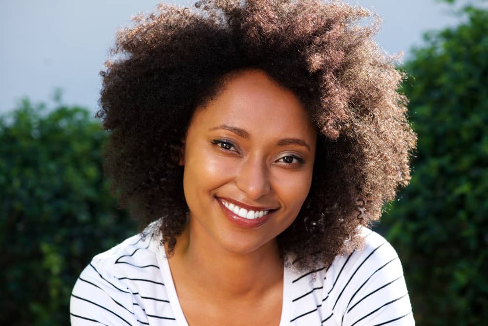 African American female outside in the sunlight where you can see the brown eumelanin and the black eumelanin