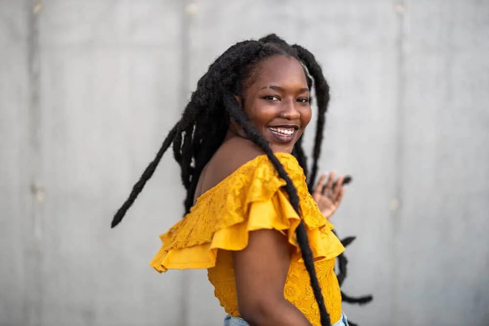 How Long Does It Take To Grow Dreads to Your Shoulders From Short Hair? 3 Cute woman with African American dreadlocks on 4C hair strands