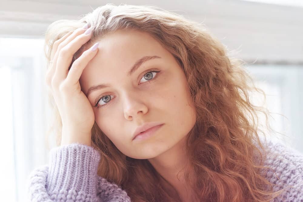 Young girl with a wavy white girl weave made from light density Peruvian hair 