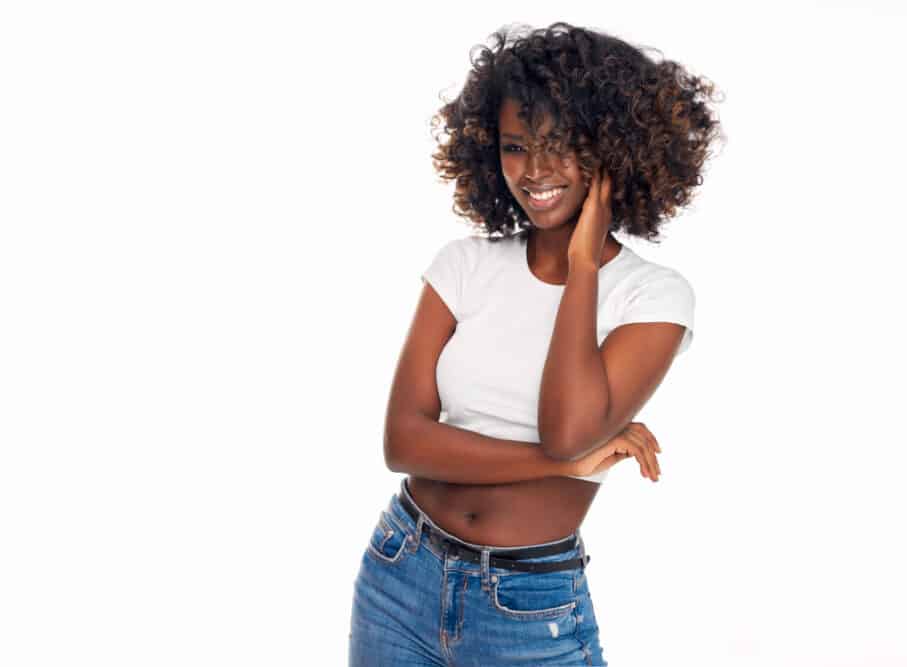 Beautiful young black lady with healthy brown and black curls