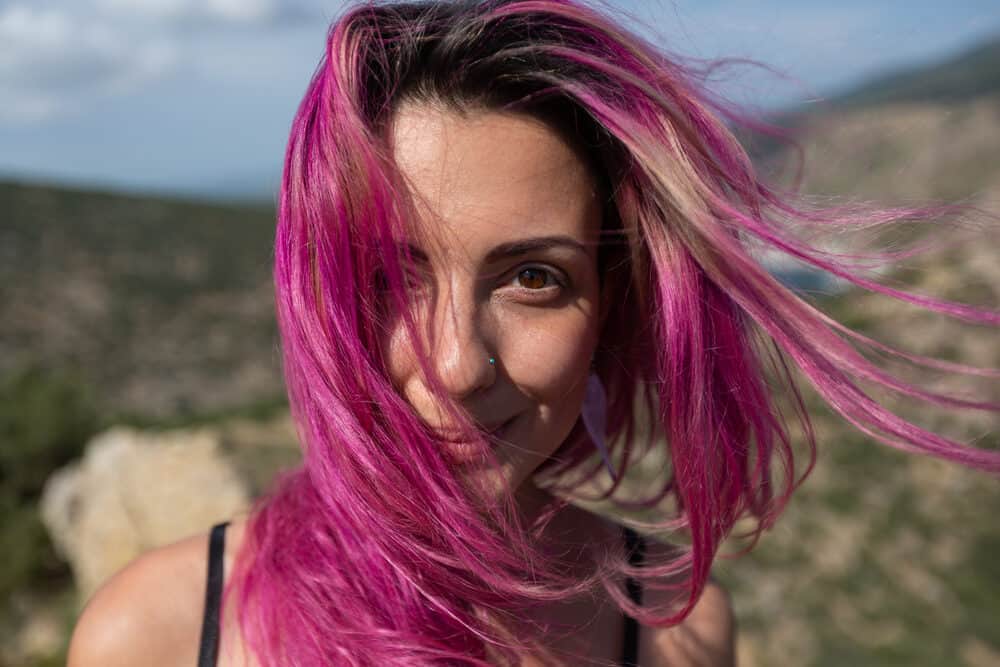 Caucasian female with a dark brown natural hair colour (color) dyed blonde and pink with Manic Panic hair dyes
