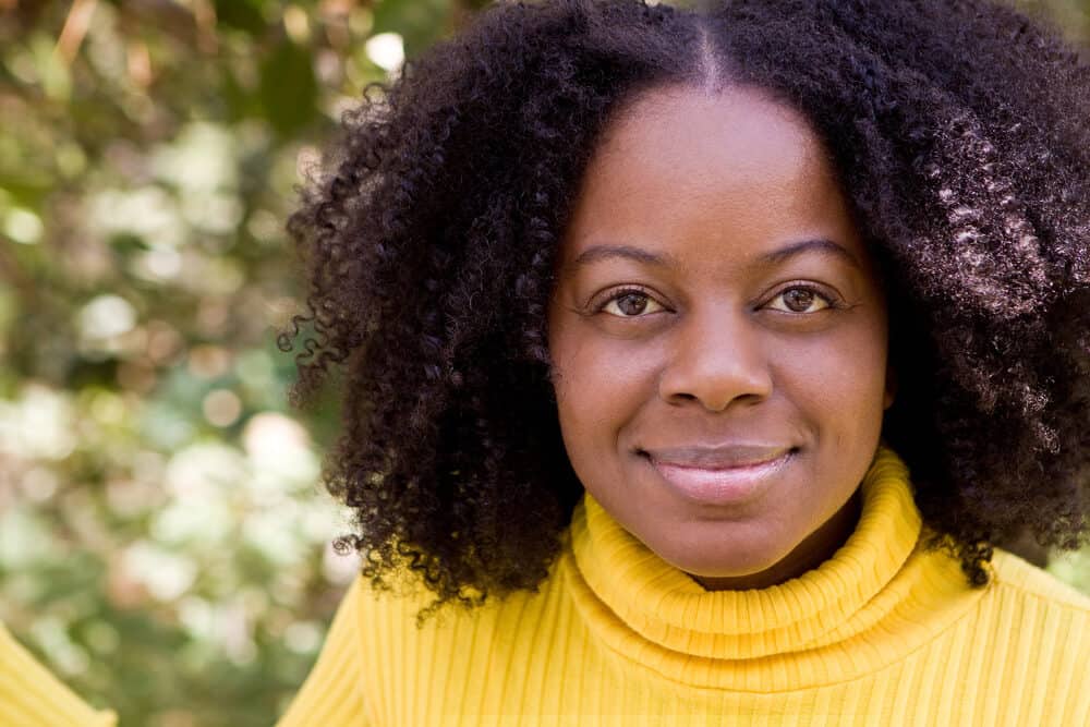 African American woman with curly natural hair after leaving the hair salon