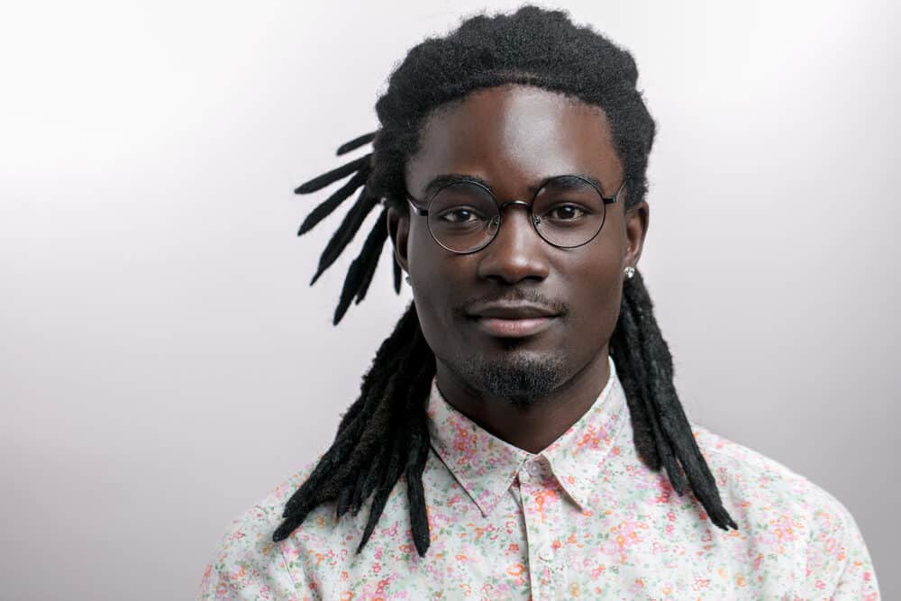 Handsome African American man with mature dreadlocks on natural hair