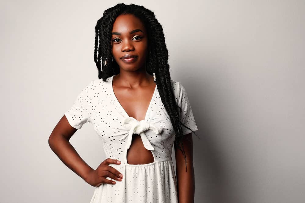 Cute black lady with dry hair preparing for a day at the beach 
