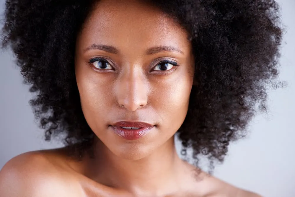 Beautiful African female soft black-brown hair colors on bouncy curls