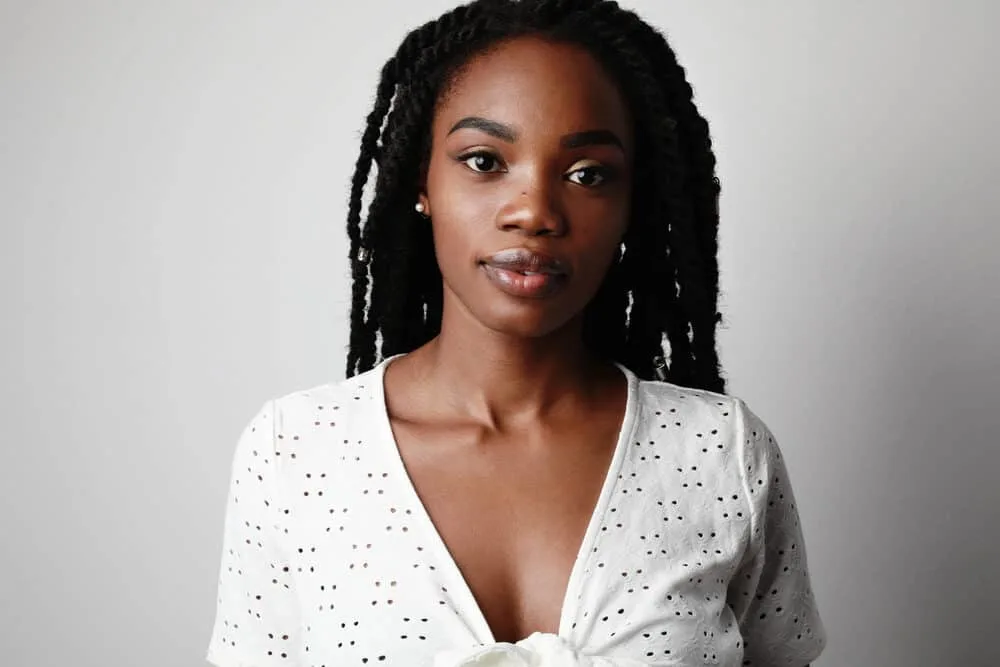 Can You Get Braids Wet in the Shower, Pool, or Rain? What Happens? 2 African American woman with a braided hairstyle with human hair for a more natural look