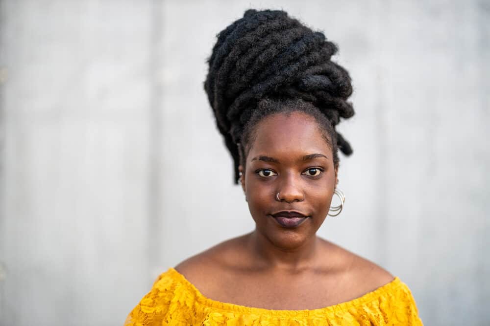 African American lady with beautiful dreadlocks in an updo hairstyle