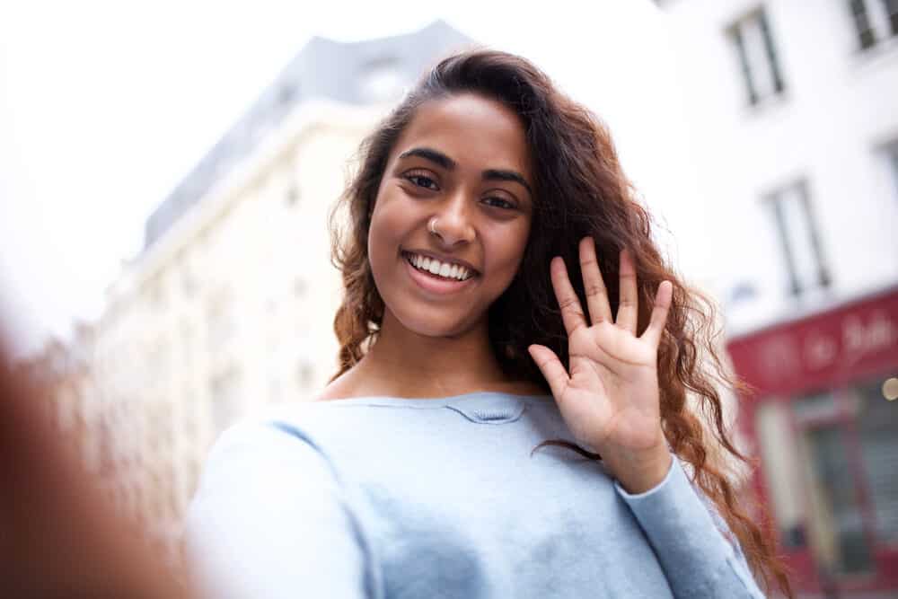 Learn How to Do Balayage on Black Hair at Home: Step-by-Step 4 Cute young Indian woman lady with lavender balayage color waves on type 2 strands