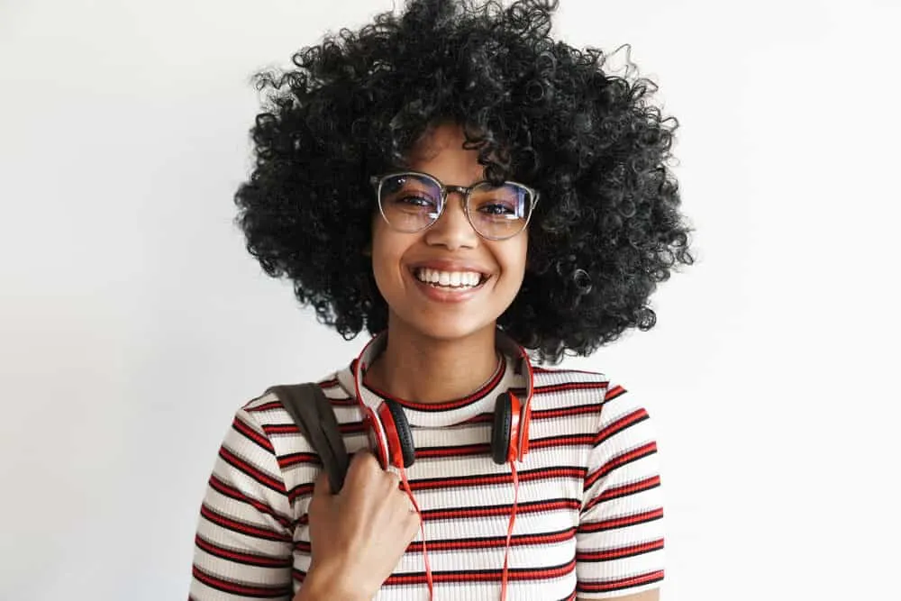 Black women with type 4 curls created from rollers and hot air from a professional hair dryer