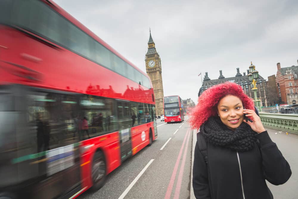 Lady walking on the street outside with red Arctic Fox hair color