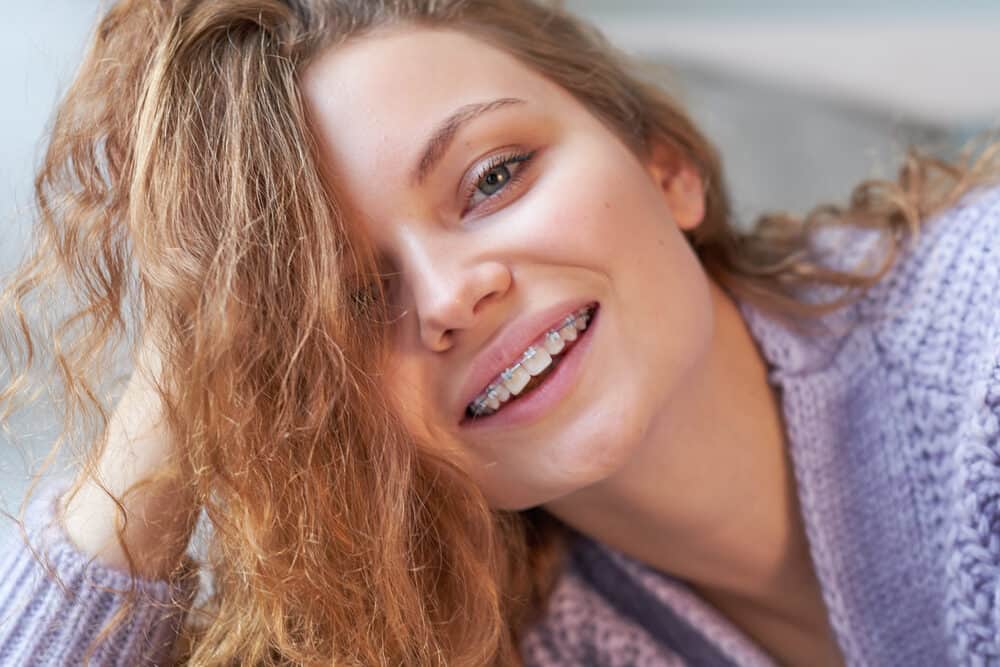 Young woman wearing a white girl weave with synthetic Russian hair 