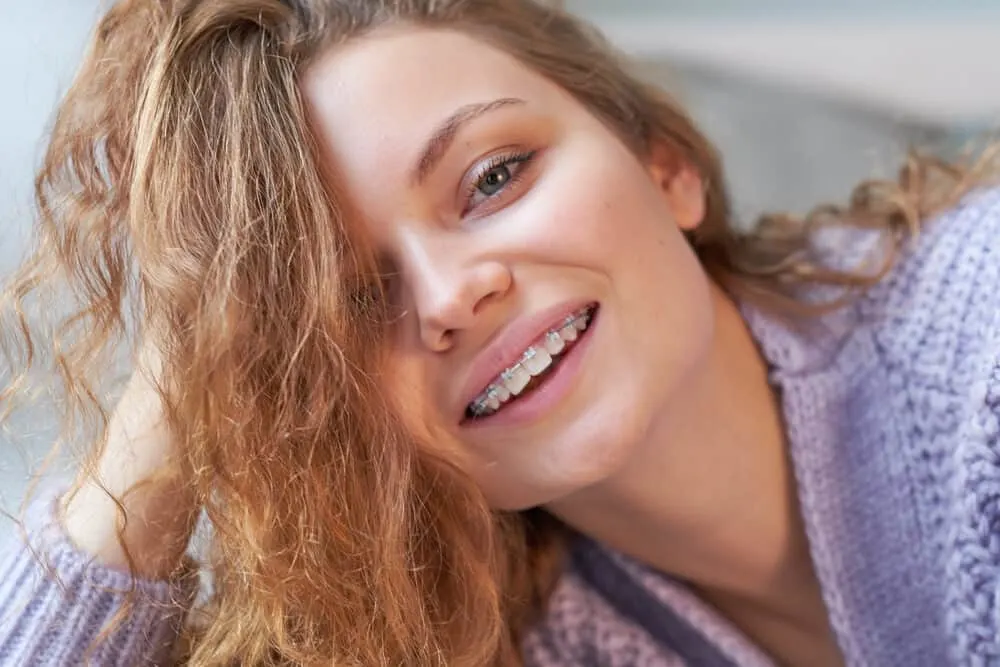 Choosing the Best Weave for White Girl Hair Types: Complete How-To Guide 2 Young woman wearing a white girl weave with synthetic Russian hair