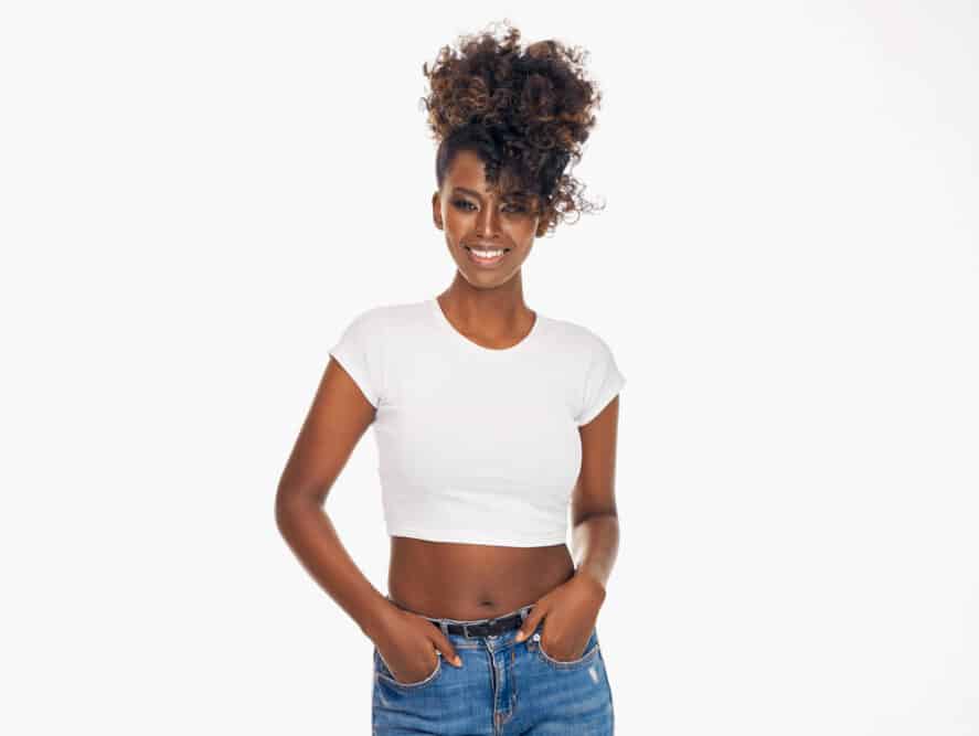 Attractive African American wearing a white t-shirt and casual pants