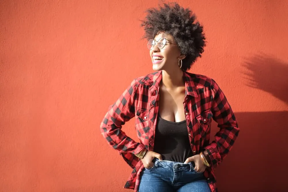 Drying Natural Hair Under a Hooded Dryer: Step-by-Step DIY Guide 2 Black women with an afro hairstyle with a pick and indirect heat from a bonnet dryer