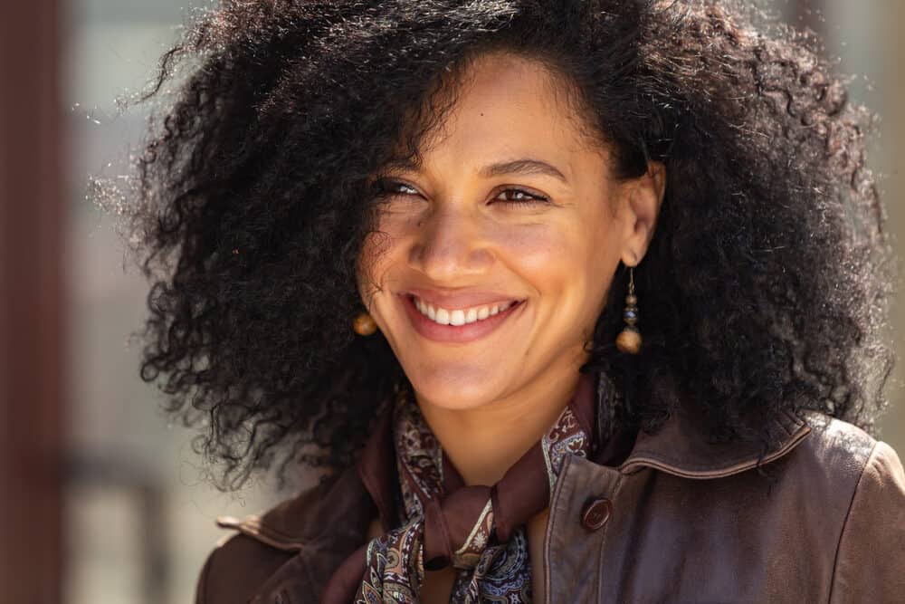 Young African American woman with type 4B curls washed with herbal essence shampoo