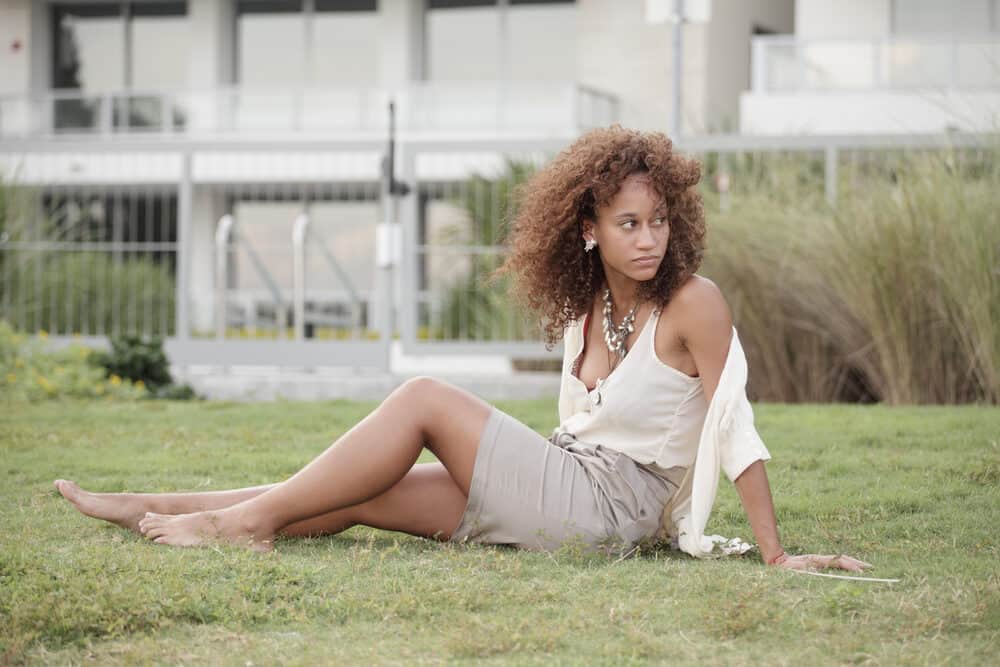 Gorgeous African American female with recently dyed brown and yellow hair that's perfect after a few washes.