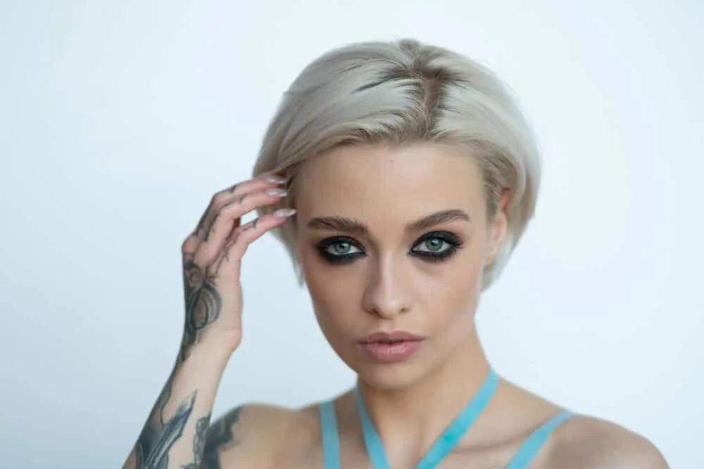 T10 Wella Toner Before and After on Orange, Yellow Hair, and More 6 Lady wearing casual clothes with bleached hair with unwanted yellow tones underneath