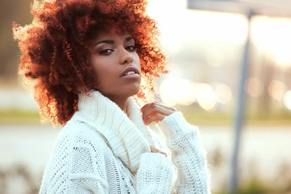 How Long Does Overtone Last on Dark, Light, Bleach Hair and More? 3 African American with a curly afro styled with Overtone hair dye and an olive oil mask.