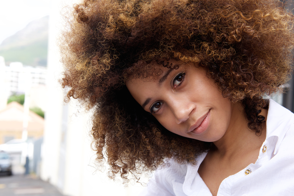 Beautiful young African American woman with color-treated hair dyed with Ion Color Brilliance Brights dye.