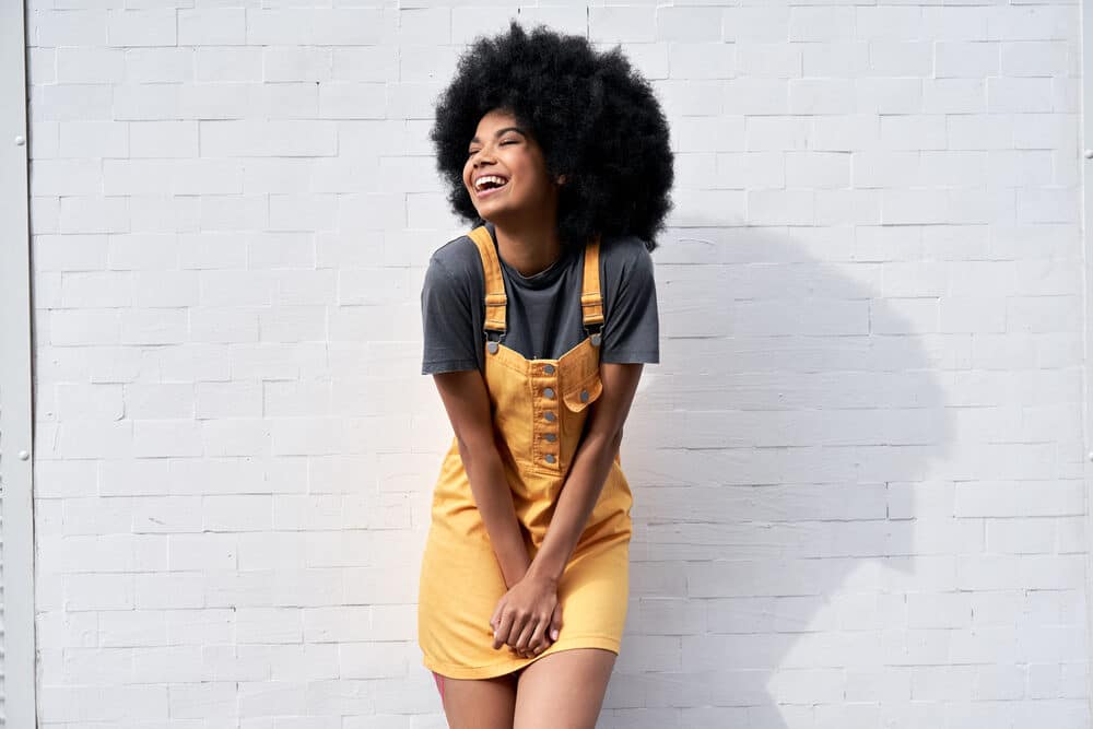 African American young woman with a curly hair type suffering from high porosity hair