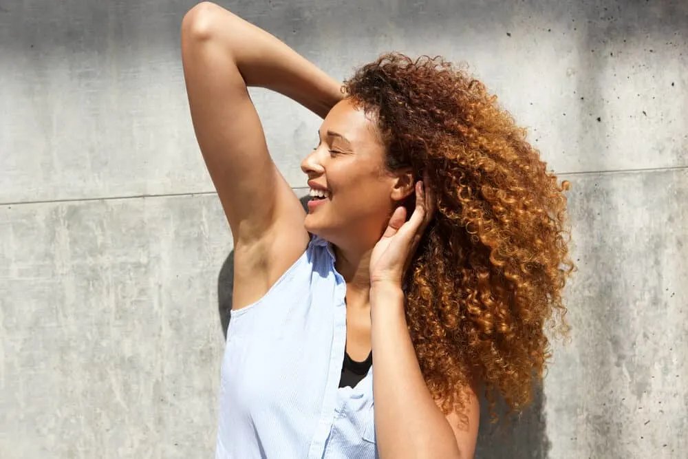 Does Color Oops Damage Hair? How to Use Color Oops Without Damage 5 Pretty adult female posing for a photo after re-coloring hair with auburn dye